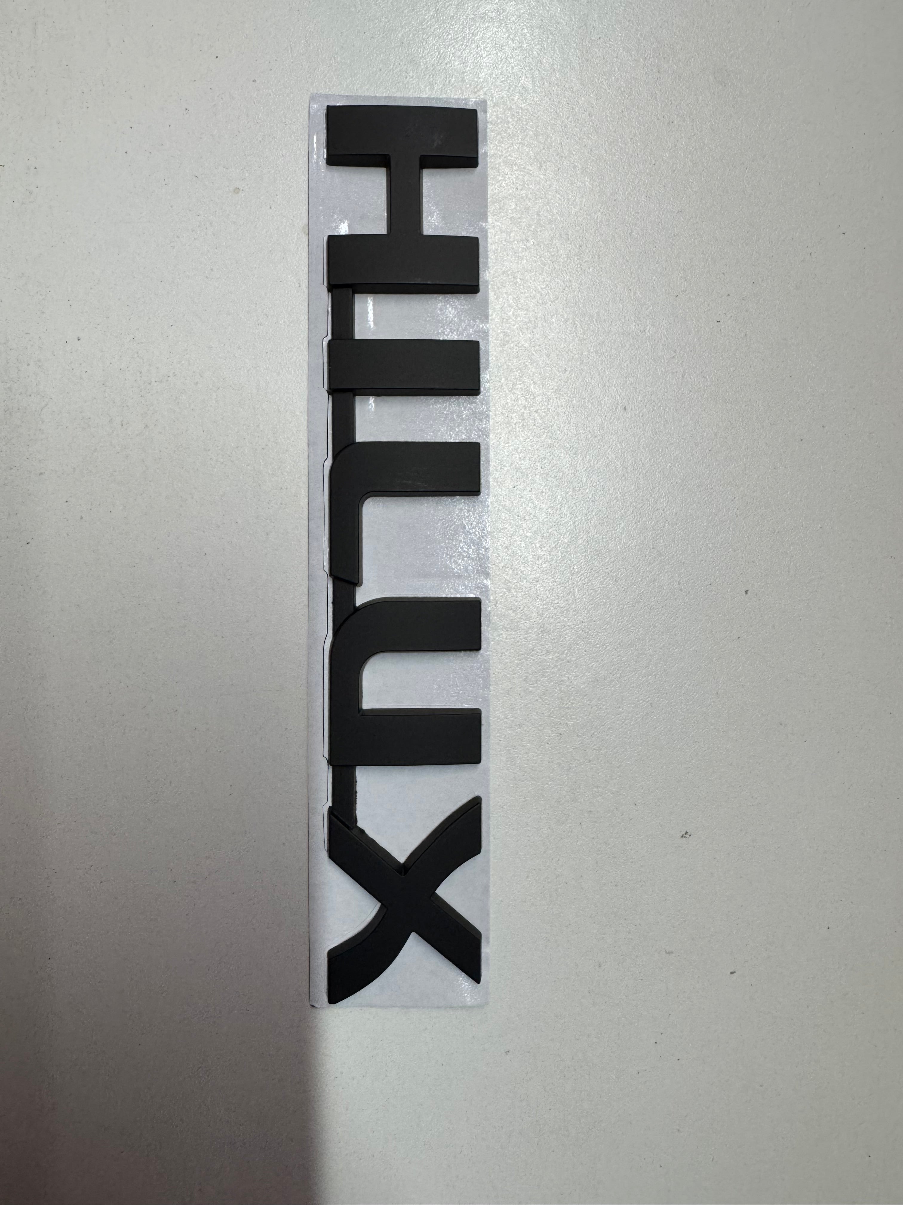 Hilux Black Metal Logo